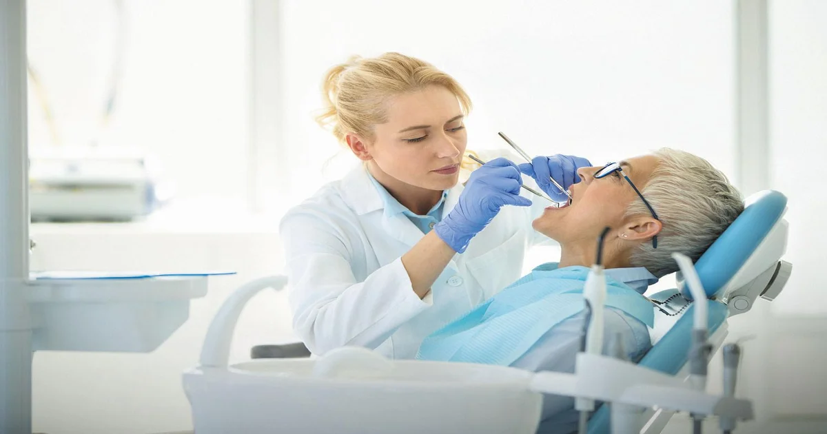 a picture of a dentist and a patient
